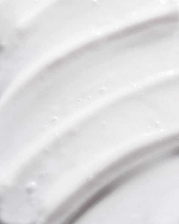 Close-up of Froday leave-in conditioner texture showing smooth, lightweight cream
