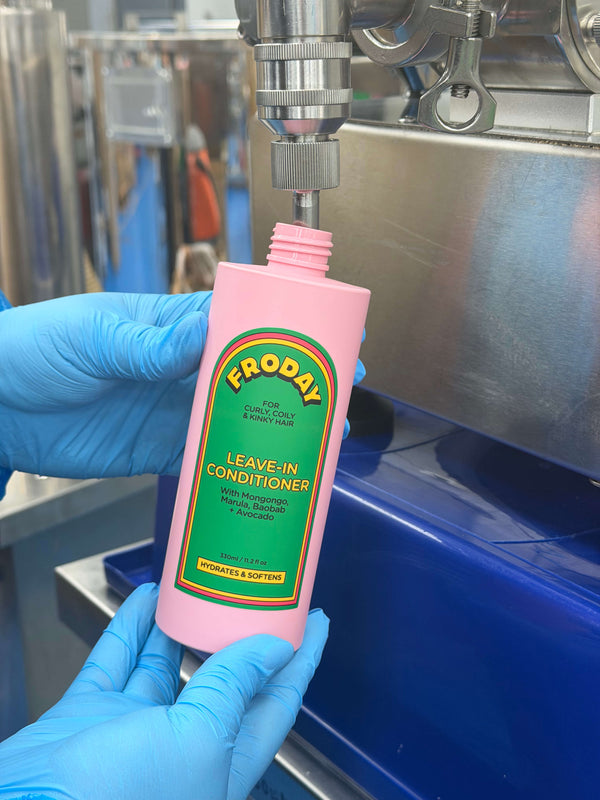 Froday leave-in conditioner being filled in lab showing product manufacturing process