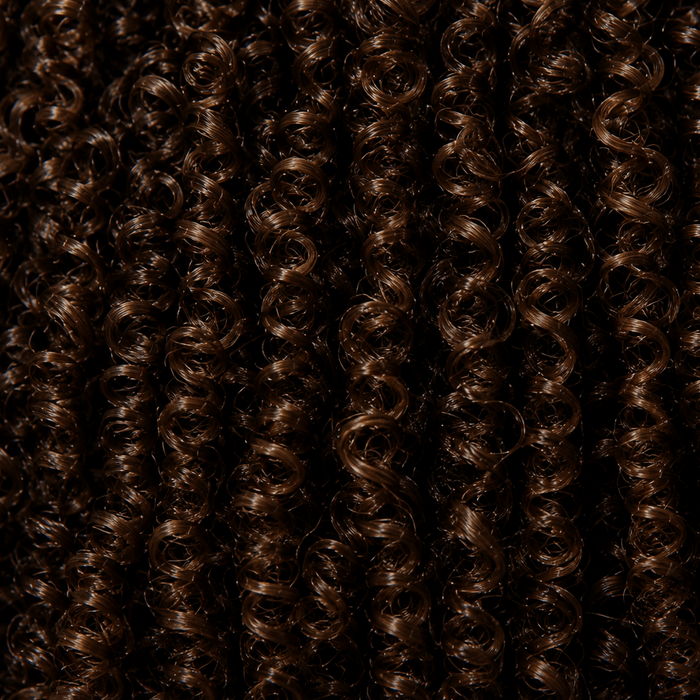 Close-up of tight textured curls with densely defined curl pattern